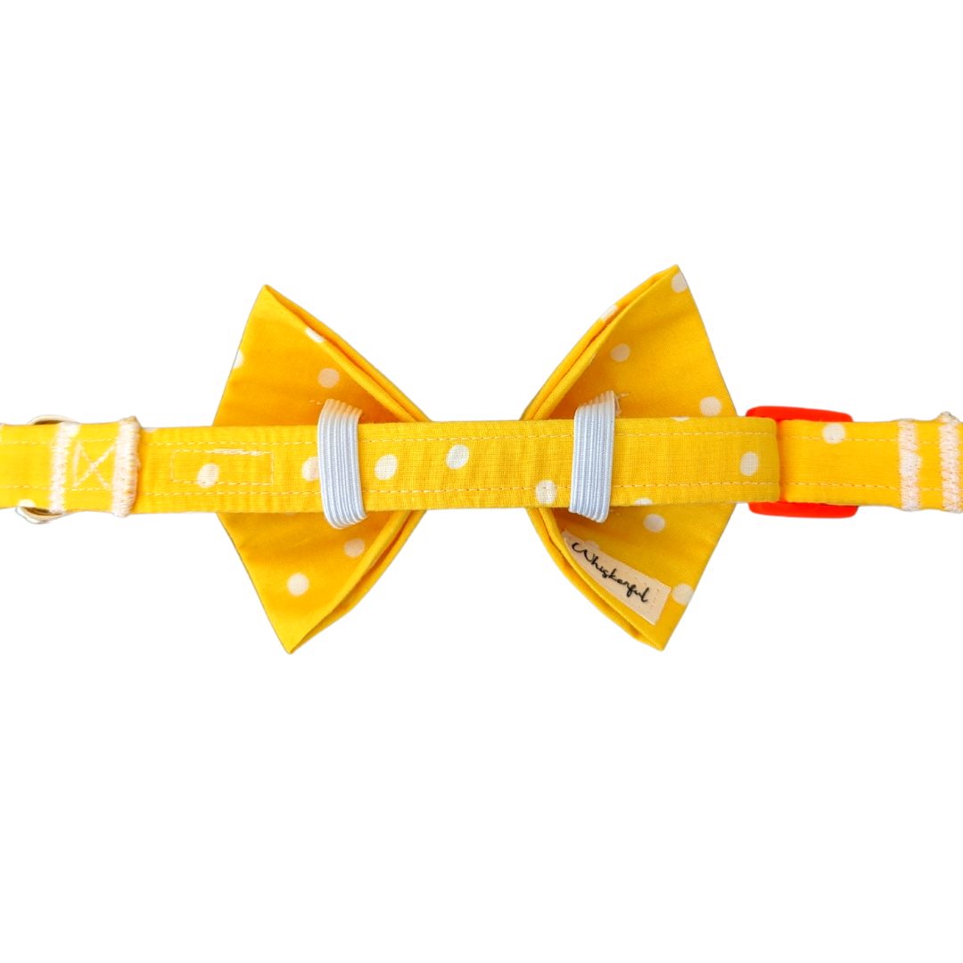 Image of the back of our Yellow Polka Dot Bow Tie, showcasing two elastic loops on each side for easy attachment to the collar. The elastics ensure a secure and droop-free fit.