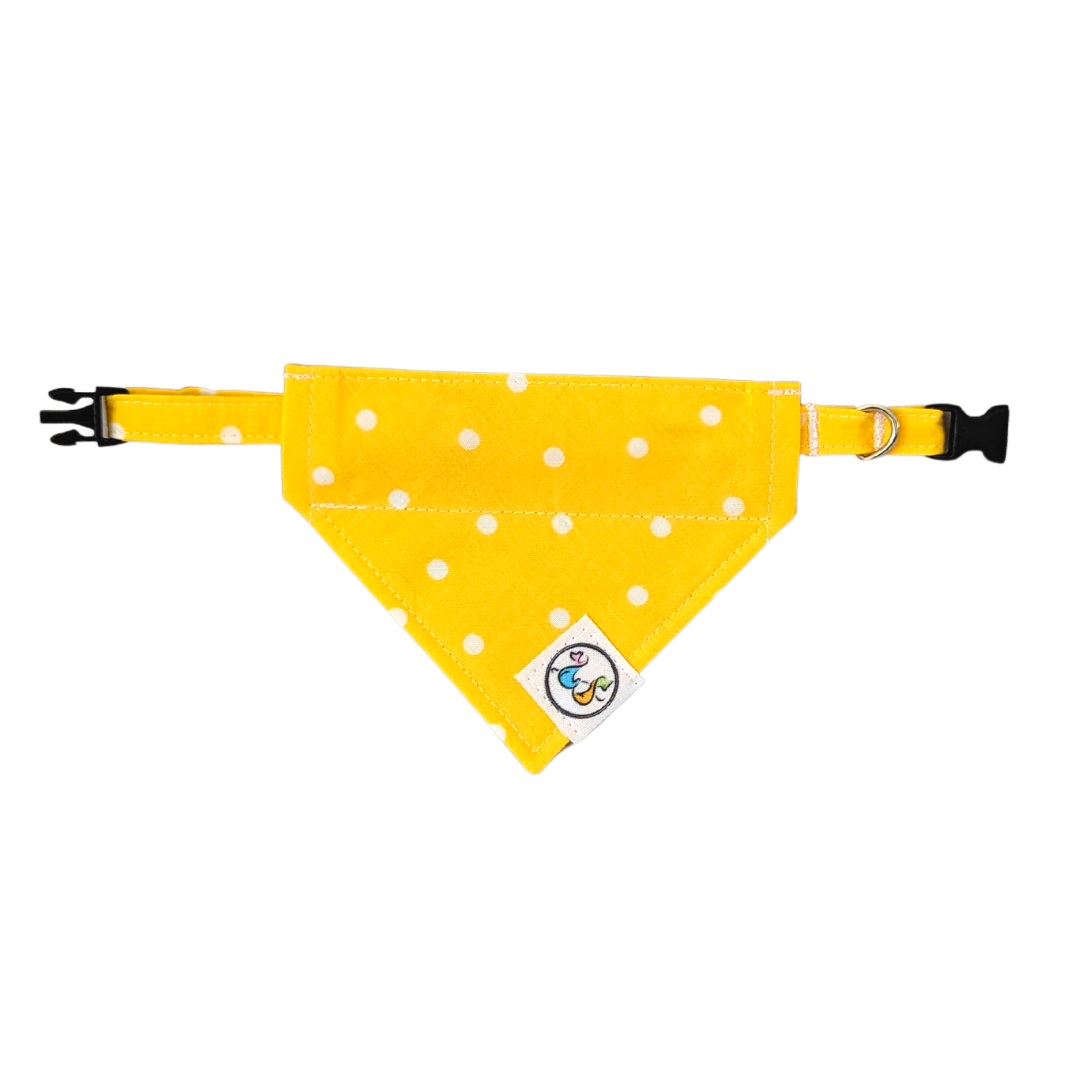 Collar looped through the yellow polka dot design, showcasing a secure and stylish way to accessorize your pet.